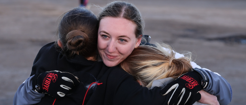 Woman hugging friends