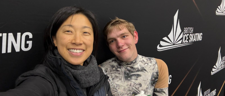 Charlie and his coach at a skating comp